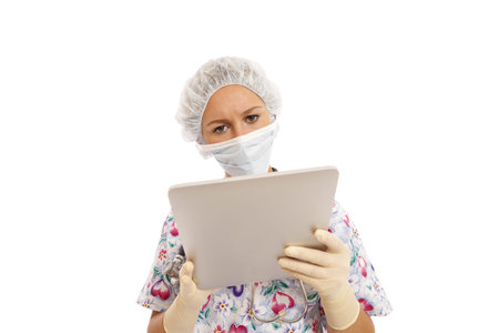 Portrait of young nurse using a touch screen computerの写真素材