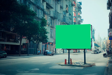 Blank green billboard on the street with cityscape background, vintage styleの写真素材