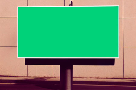 Blank green billboard on the street. Mock up design.の写真素材