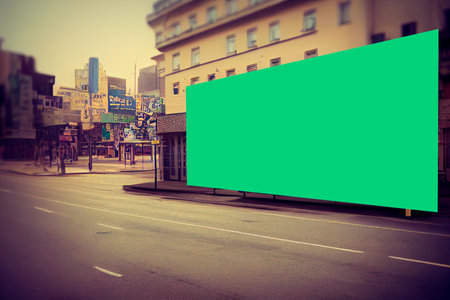 Blank green billboard in the city. Filtered image processed vintage effect.の写真素材