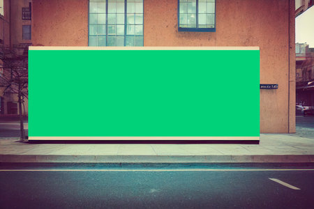 Blank billboard on the street with cityscape background. Mock upの写真素材