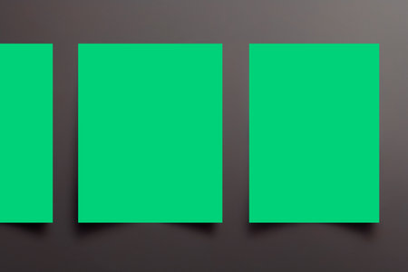 Two green sheets of paper on a dark background. 3d illustrationの写真素材