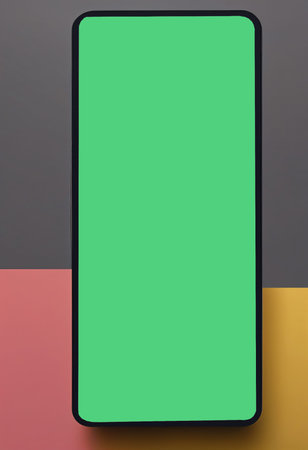 Smartphone with green screen on colorful background. Copy space for text.の写真素材