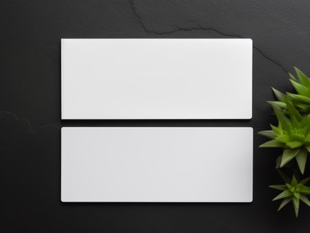 Blank business cards on black background. Mockup for branding identity.の写真素材