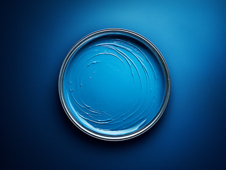 Blue paint on a glass plate on a blue background. 3d renderingの写真素材
