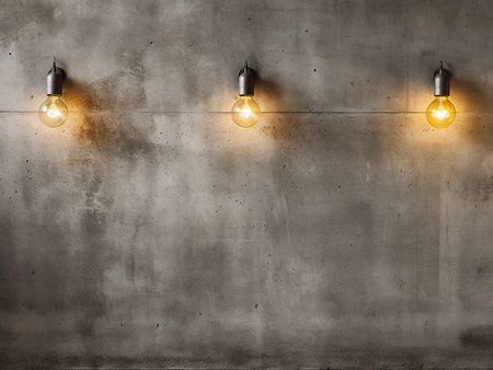 Light bulbs on concrete wall with copy space. 3D Renderingの写真素材