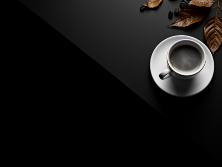 Coffee cup and coffee beans on black background with copy spaceの写真素材