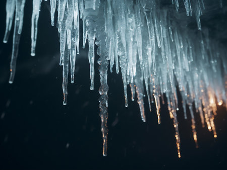 Icicles hanging from the ceiling of a cave in winter.の写真素材