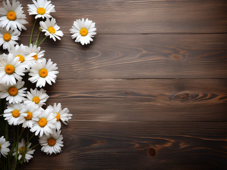 Beautiful daisies on wooden background. Top view with copy spaceの写真素材