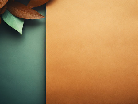 Leaves on green and brown paper background with copy space for textの写真素材