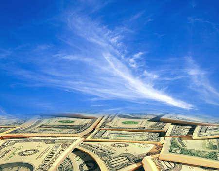 Clouds in the sky with dollarsの写真素材