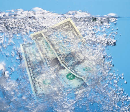 Dollars in waterの写真素材