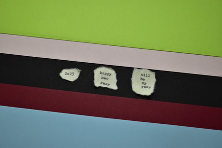 Crumpled paper with words on it against green and blue backgroundの写真素材