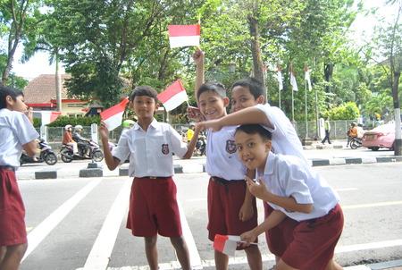 elementary school students are very pleased and excited to welcome the arrival of  the president Jokowi during his visit to Jogjakartaの写真素材