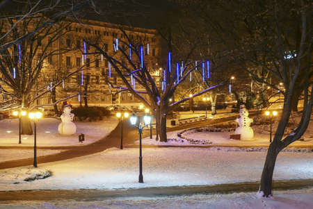 Snowman in the park of evening Rigaの素材