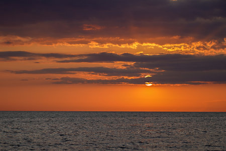 Sunset Over the Calm Seaの写真素材