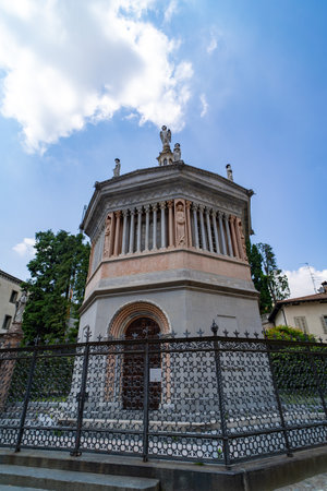 The octagonal Baptistery of Bergamo, an exquisite historical structure with statues and ornate details, located in the charming Piazza Duomo.の写真素材