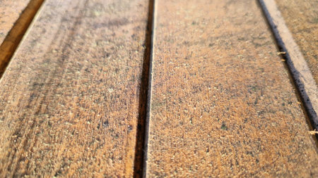 Rustic wooden planks captured in close-up, highlighting the deep textures and natural color variations for design and craftsmanship projects.の写真素材