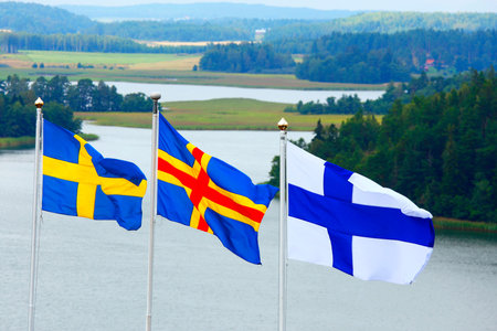 Flags of Sweden, Aland and Finland  from left to right  の写真素材