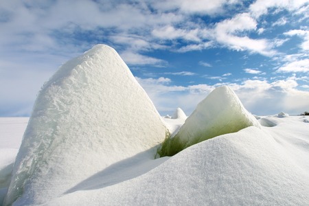 Hummocks on coastline in cold spring day.の写真素材