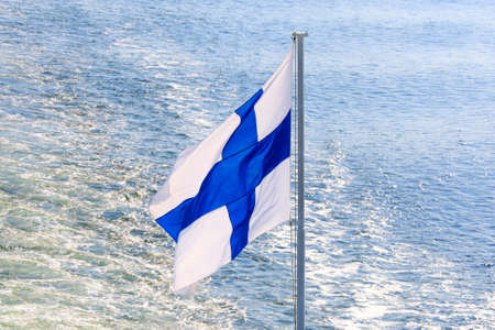 Flag of Finland on cruise ship on Baltic Sea.の写真素材