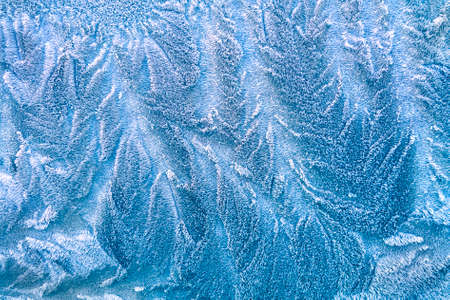 Abstract white frost pattern on glass.の写真素材