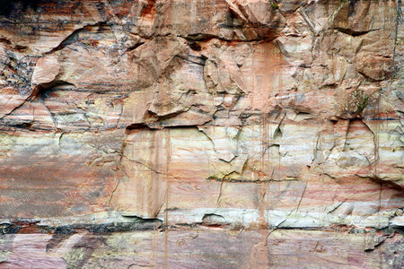 Geological feature: layered sandstone rock wall in canyon, Northern Europe.