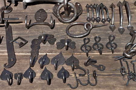 Specimens of rustic ironwork on woode table.
