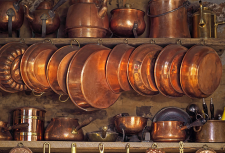 Ancient cookware in rural kitchen as decoration or aesthetic and nostalgic link to past.の写真素材