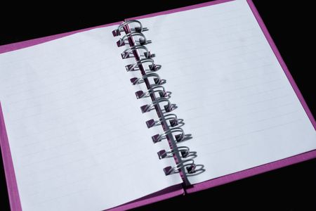 Opened book on the black background の写真素材