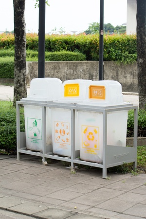 plastic refuse bin in green parkの写真素材