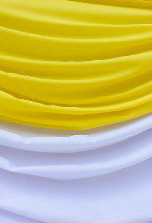 fabric white and yellow background or liquid wavesの写真素材