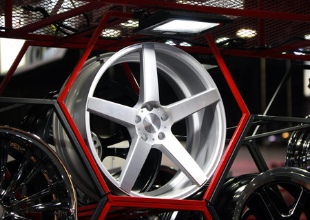 Alloy Wheel of car on the shelf with red Hexagon frame. Alloy wheels are wheels that are made from...
