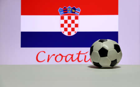 Small football on the white floor and Croatian nation flag with the text of Croatia background. The concept of sport.の写真素材