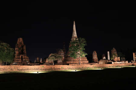 Night shot of incomplete small stupa in the ruins of ancient remains at Wat Mahathat temple, it built in 1374 AD in the Ayutthaya period.の写真素材