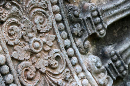 Close up stone carving of the wheel of the dharma. in archaeological site of Srithep ancient town in Petchaboon, Thailand. The influence of ancient Draravati culture, 8th-9th century A.D.のeditorial素材