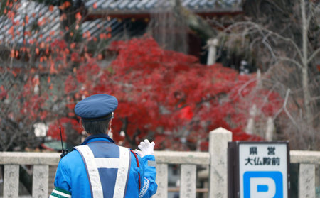 Zoshicho, Nara, Japan, November 21, 2017 : Back of Japanese traffic police in blue uniform...