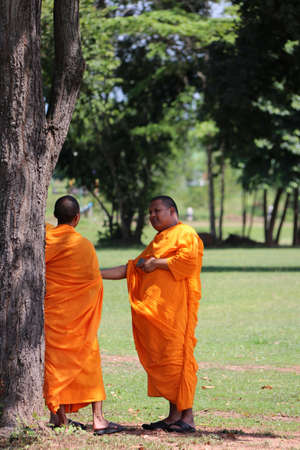 Sri Thep, Petchaboon, Thailand, Sep 06, 2018: Two Thai monks standing under the tree.のeditorial素材
