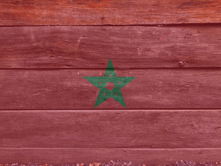 Flag of Morocco on wooden wall background. Grunge Moroccan flag texture, red field with a black-bordered green pentagram.の写真素材