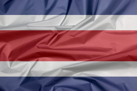 Fabric flag of Costa Rica. Crease of Costa Rican flag background, blue red and white color.