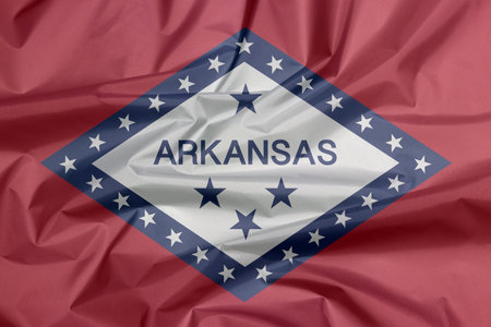 Fabric flag of Arkansas. Crease of Arkansas flag background, The states of America, A field of red...