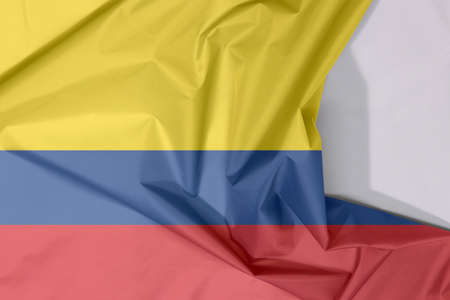 Colombia fabric flag crepe and crease with white space, a horizontal tricolor of yellow (double-width), blue and red.の写真素材