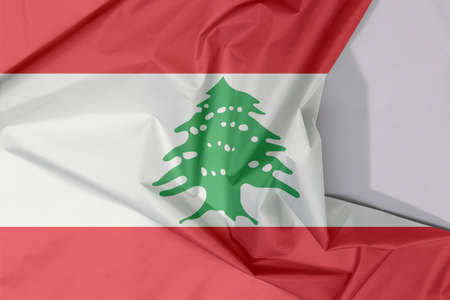 Lebanon fabric flag crepe and crease with white space, triband of red and white, charged with a green Lebanon Cedar.の写真素材