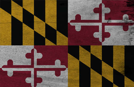 Flag of Maryland on wooden plate background. Grunge Maryland flag texture, The states of America. Heraldic banner of George Calvert, 1st Baron Baltimore.の写真素材