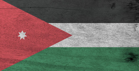 Flag of Jordan on wooden plate background. Grunge Jordanian flag texture, horizontal triband of black, white and green; with a red chevron and star.の写真素材