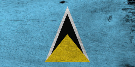 Flag of Saint Lucia on wooden plate background. Grunge Saint Lucia flag texture, A light blue field...
