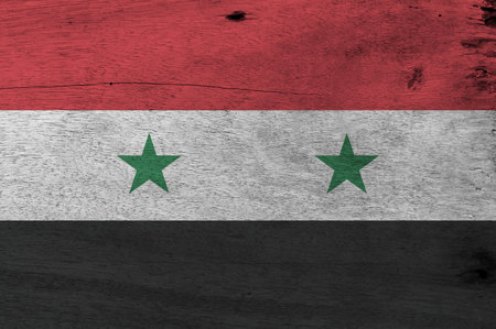 Flag of Syrian Arab Republic on wooden plate background. Grunge Syrian Arab Republic flag texture, A...