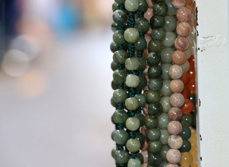 The bead, rounded shape with perforated for threading as a necklace or rosary.