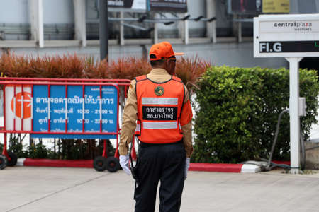 Bangyai, Nonthaburi, Thailand-August 11, 2019 : Volunteer traffic control performing duties on the road at entrance of central plaza westgate department store parking.のeditorial素材
