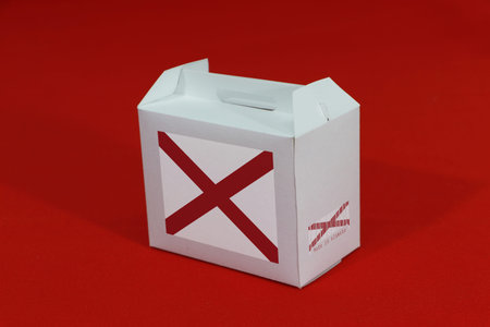 Alabama flag on white box with barcode and the color of state flag on red background. The concept of...